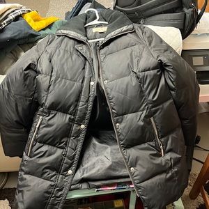 Black Michael Kors puffy jacket. Jacket comes down to knees.